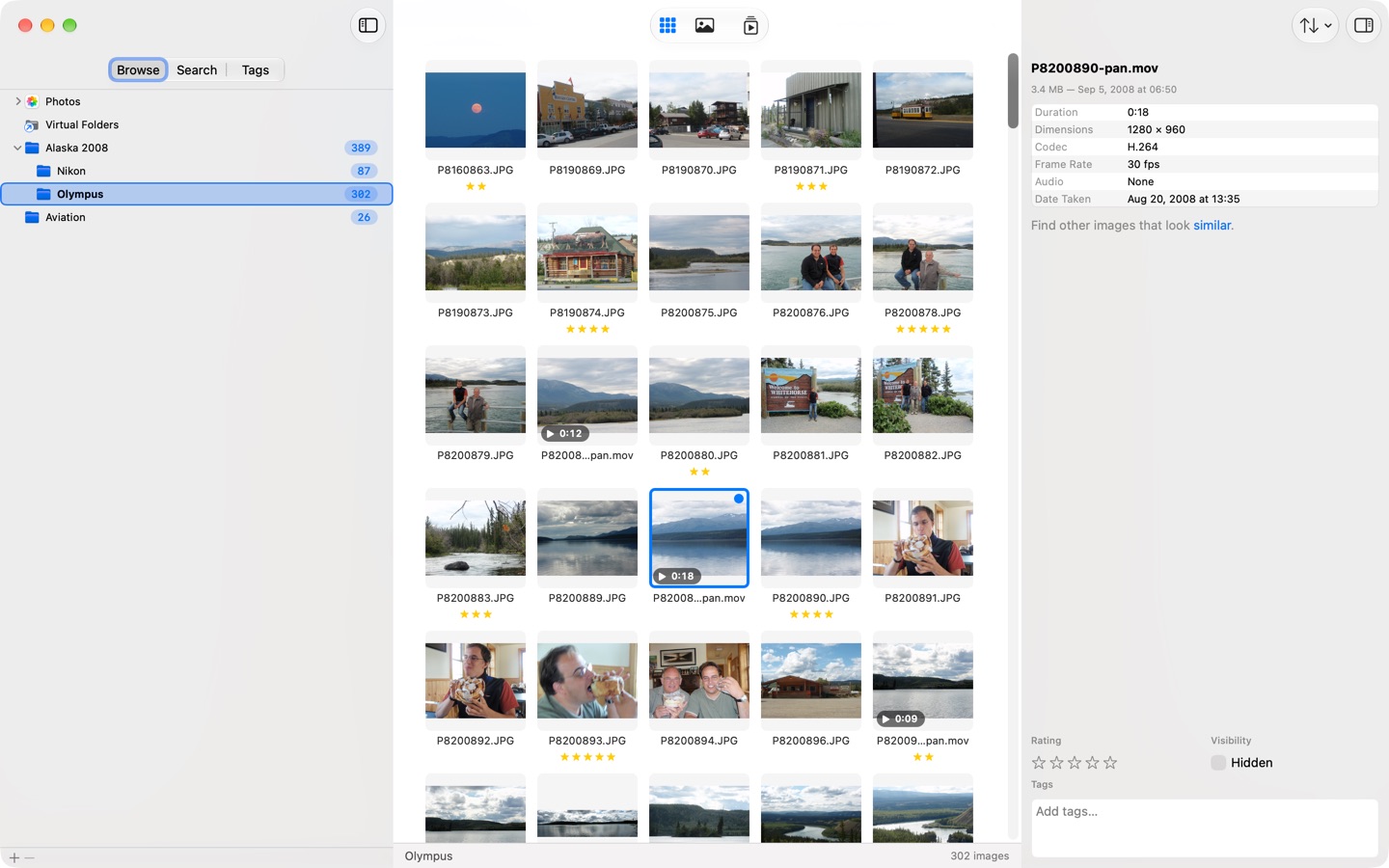 SeeDis on macOS: video tiles with play symbols and running times among the photos in the grid, and the inspector showing the selected video's duration, codec and frame rate.